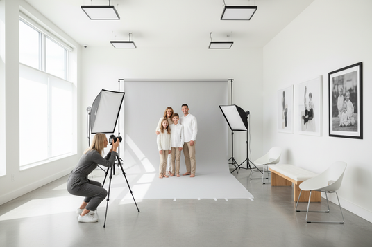 Family portrait setting with a studio showing a professional photographer shooting a family portrait studio needs to look modern