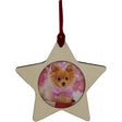A star-shaped wooden ornament with a photo of a small, fluffy brown dog wearing a pink bow collar.