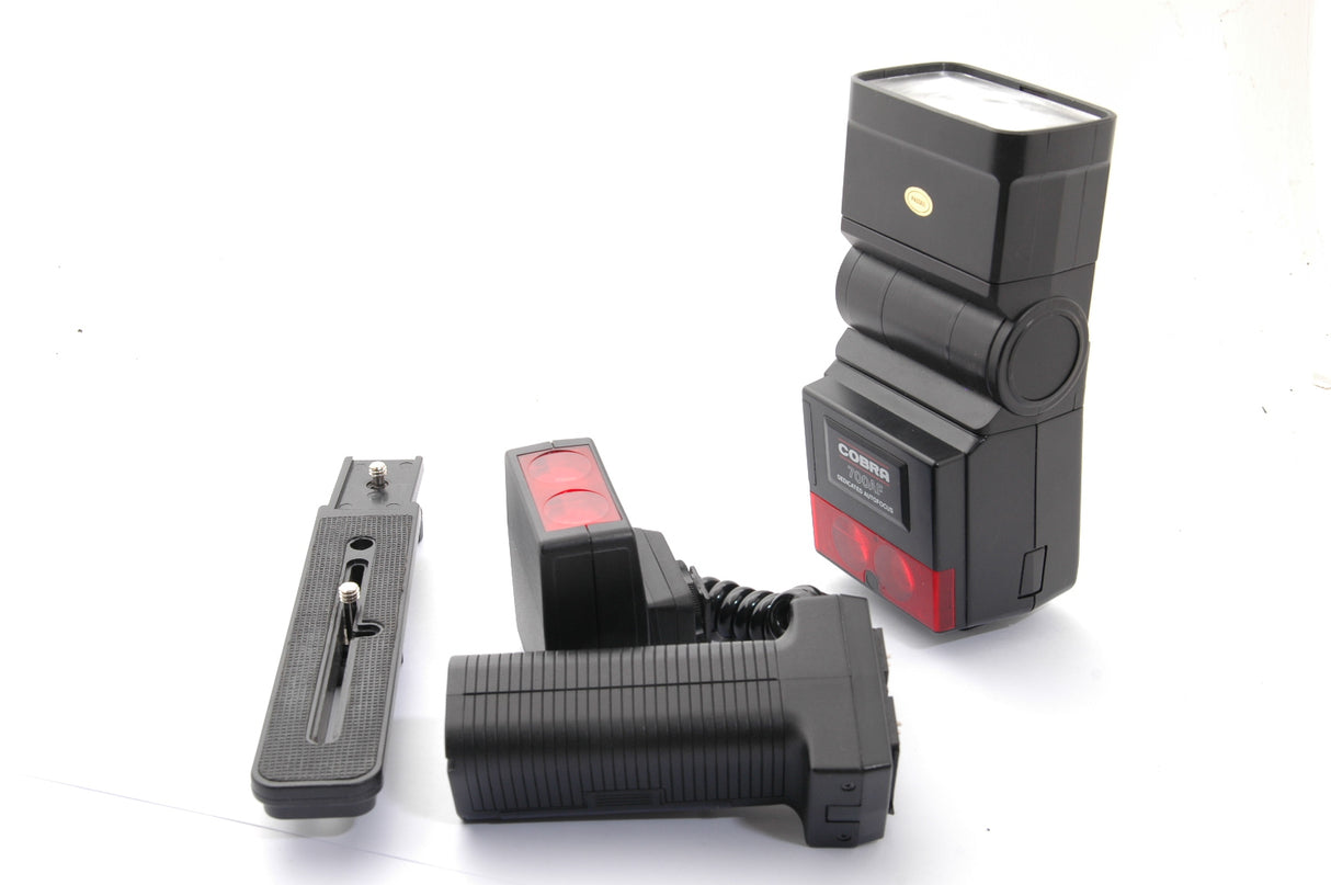 Used Cobra 700AF TTL with Pro-Grip and Bracket