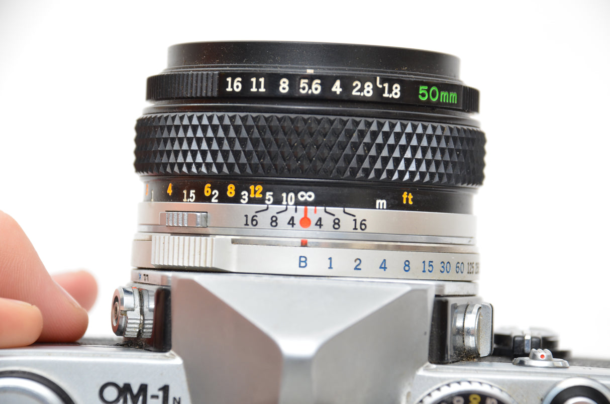 Used Olympus OM-1 SLR camera with Olympus Zuiko Auto-s 50mm f/1.8 lens